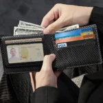 ESR Geo Wallet in hand with ID, cards and bills