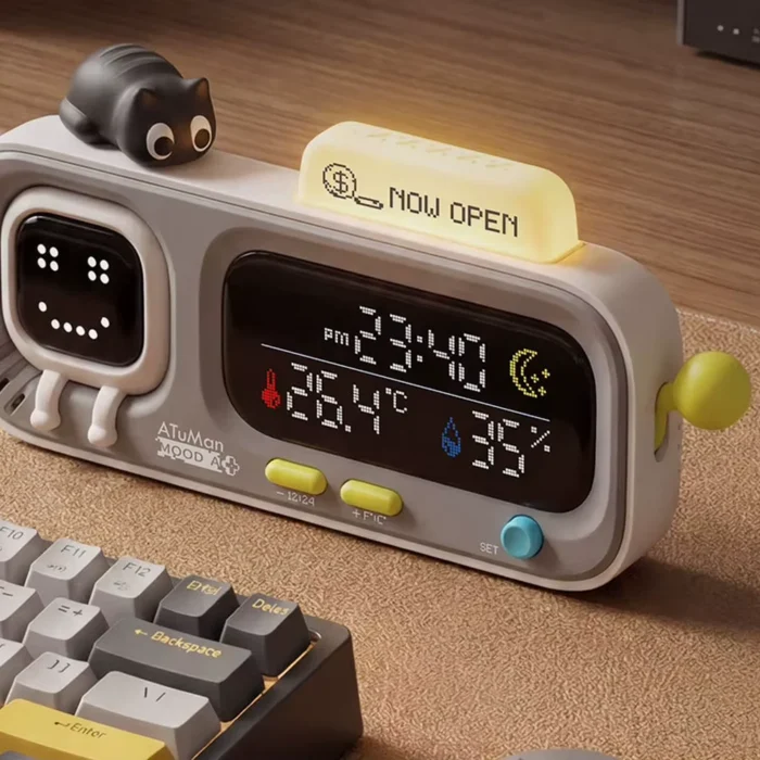 MOOD A on a desk next to a mechanical keyboard